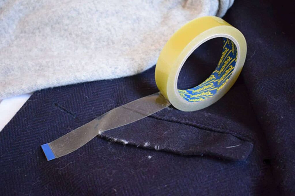 Use scotch tape - How to Remove Lint From Clothes